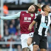 NEWCASTLE UPON TYNE, ENGLAND - FEBRUARY 29: Jamaal Lascelles of Newcastle United vies with Jeff Hendrick of Burnley during the Premier League match between Newcastle United and Burnley FC at St. James Park on February 29, 2020 in Newcastle upon Tyne, United Kingdom. (Photo by Ian MacNicol/Getty Images)