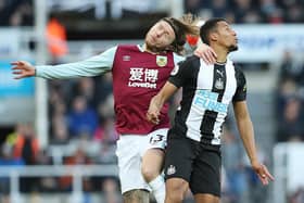 NEWCASTLE UPON TYNE, ENGLAND - FEBRUARY 29: Jamaal Lascelles of Newcastle United vies with Jeff Hendrick of Burnley during the Premier League match between Newcastle United and Burnley FC at St. James Park on February 29, 2020 in Newcastle upon Tyne, United Kingdom. (Photo by Ian MacNicol/Getty Images)