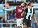 NEWCASTLE UPON TYNE, ENGLAND - FEBRUARY 29: Jamaal Lascelles of Newcastle United vies with Jeff Hendrick of Burnley during the Premier League match between Newcastle United and Burnley FC at St. James Park on February 29, 2020 in Newcastle upon Tyne, United Kingdom. (Photo by Ian MacNicol/Getty Images)