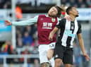 NEWCASTLE UPON TYNE, ENGLAND - FEBRUARY 29: Jamaal Lascelles of Newcastle United vies with Jeff Hendrick of Burnley during the Premier League match between Newcastle United and Burnley FC at St. James Park on February 29, 2020 in Newcastle upon Tyne, United Kingdom. (Photo by Ian MacNicol/Getty Images)