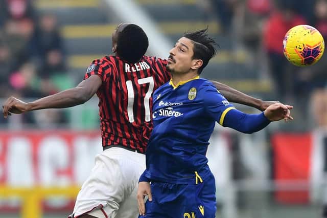 AC Milan's Portuguese forward Rafael Leao (L) and Verona's German defender Koray Guenter go for a header during the Italian Serie A football match AC Milan vs Verona on February 2, 2020 at the San Siro stadium in Milan. (Photo by Miguel MEDINA / AFP) (Photo by MIGUEL MEDINA/AFP via Getty Images)