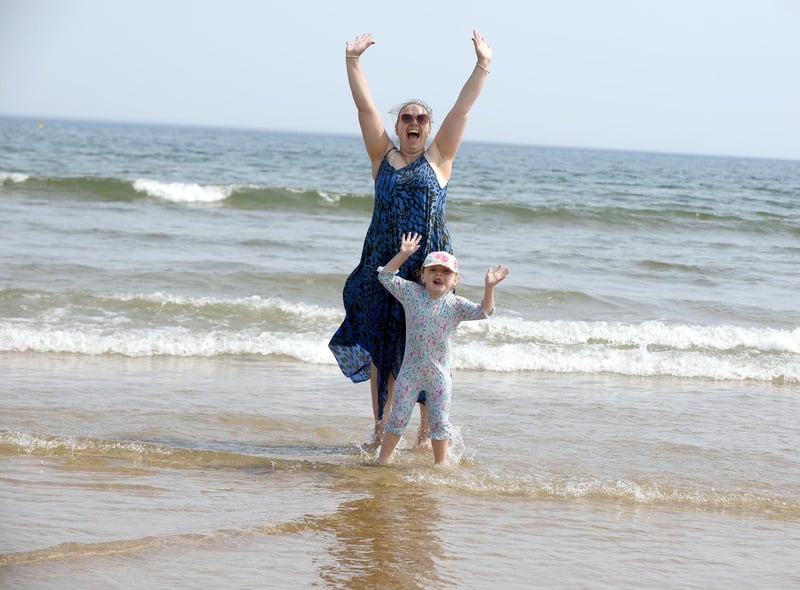 High temperatures at Sandhaven Beach. Kelly Howe with daughter Sienna, 4.