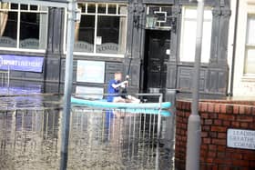 Heavy rain causes flooding at Tyne Dock at Kennedy's pub on the junction of South Eldon Street and Temple Town with a paddle boarder taking to the water.