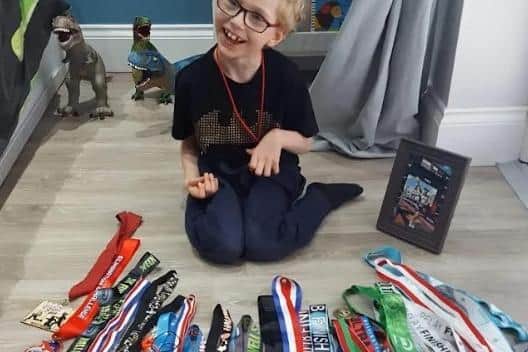Toby with Jodi's medals