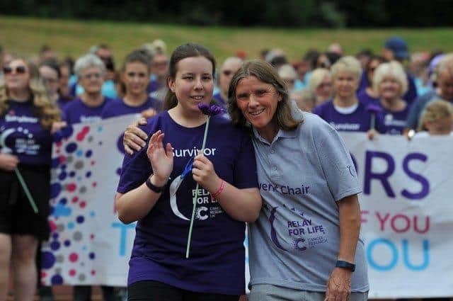 Cancer survivor Lily Slater with Ann Walsh