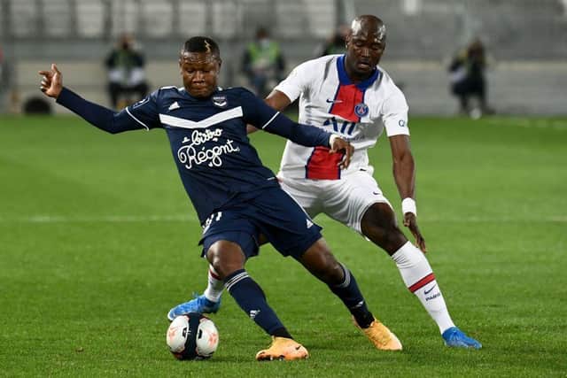 Bordeaux's Nigerian forward Samuel Kalu (L) fights for the ball with Paris Saint-Germain's Portuguese midfielder Danilo Pereira during the French L1 football match between Bordeaux (FCGB) and Paris-Saint-Germain (PSG) at the Matmut Atlantique Stadium on March 3, 2021 (Photo by PHILIPPE LOPEZ/AFP via Getty Images)
