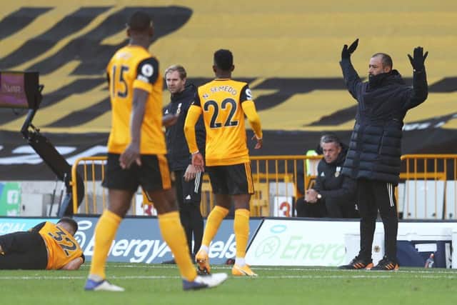 Nuno Espirito Santo, Manager of Wolverhampton Wanderers  gives his team instructions  during the Premier League match between Wolverhampton Wanderers and Fulham at Molineux on October 04, 2020 in Wolverhampton, England.