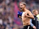 Bruno Guimaraes celebrates Newcastle United's win over Chelsea.