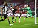 Callum Wilson of Newcastle United scores his team's first goal past Lukasz Fabianski of West Ham United  (Photo by Michael Regan/Getty Images)