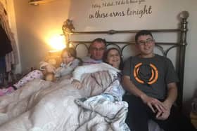 Emma Corkin (centre) with daughter Ebbie (left) partner Tony and son Daniel.