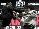 Deontay Wilder (L) and Tyson Fury get into an altercation during their press conference at the MGM Grand Las Vegas (Photo: JOHN GURZINSKI/AFP via Getty Images)