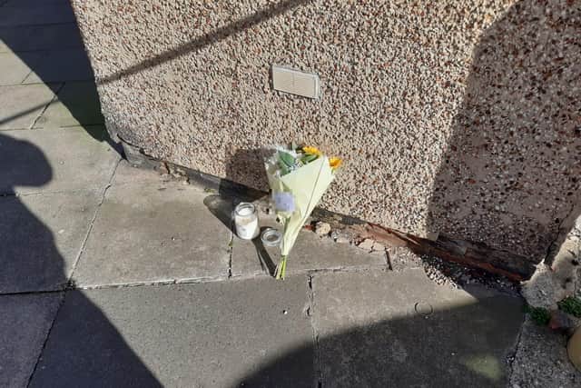 A floral tribute in Marshall Wallis Road following the death of a 25-year-old man in the early hours of Saturday, March 5.
