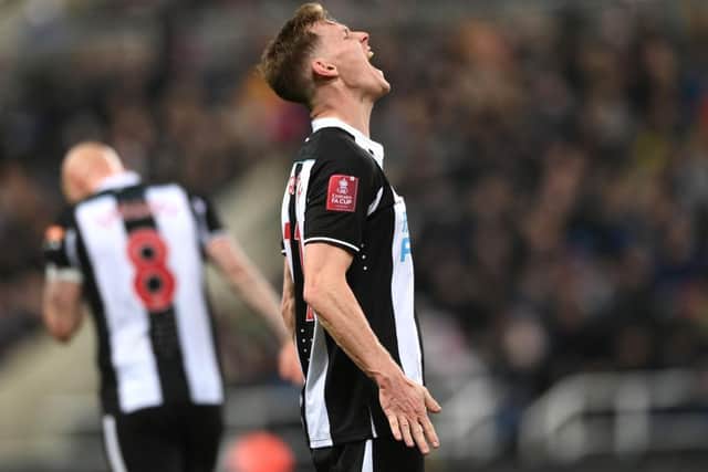 NEWCASTLE UPON TYNE, ENGLAND - JANUARY 08: Newcastle defender Emil Krafth reacts with frustration during the Emirates FA Cup Third Round match between Newcastle United and Cambridge United at St James' Park on January 08, 2022 in Newcastle upon Tyne, England. (Photo by Stu Forster/Getty Images)