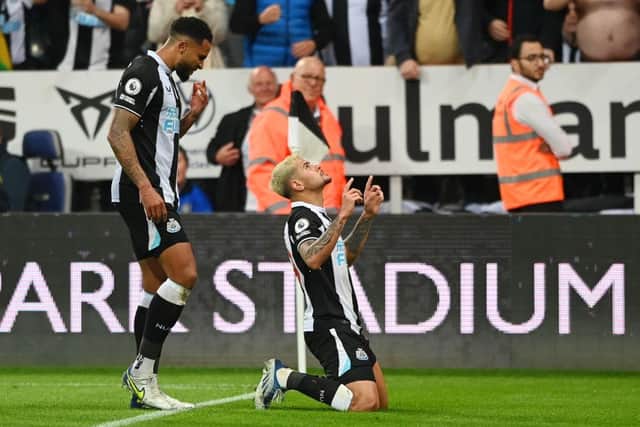 Bruno Guimaraes of Newcastle United celebrates with teammate Jamaal Lascelles after scoring their team's second goal during the Premier League match between Newcastle United and Arsenal at St. James Park on May 16, 2022 in Newcastle upon Tyne, England. (Photo by Stu Forster/Getty Images)