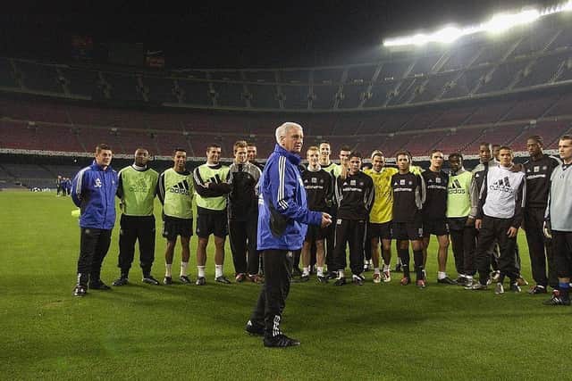 Newcastle United manager Bobby Robson talks to his players at a training session at the Nou Camp in December 2002.