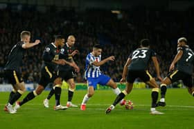 Neal Maupay of Brighton & Hove Albion runs with the ball from Jacob Murphy and Joelinton of Newcastle United during the Premier League match between Brighton & Hove Albion and Newcastle United. (Photo by Charlie Crowhurst/Getty Images)
