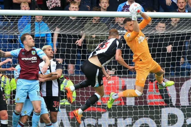 Newcastle United's Slovakian goalkeeper Martin Dubravka catches the ball during the English Premier League football match between Burnley and Newcastle United at Turf Moor in Burnley, north west England on May 22, 2022. (Photo by LINDSEY PARNABY/AFP via Getty Images)