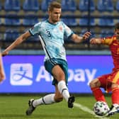 Norway's Kristoffer Ajer (L) fights for the ball with Montenegro's Stevan Jovetic (R) during the FIFA World Cup Qatar 2022 qualification Group G football match between Montenegro and Norway at the Podgorica City Stadium, in Podgorica, on March 30, 2021.