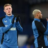 Sean Longstaff of Newcastle United applauds fans while warming up prior to  the Premier League match between Everton and Newcastle United at Goodison Park on March 17, 2022 in Liverpool, England. (Photo by Stu Forster/Getty Images)