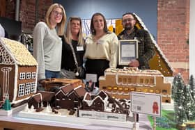 Gentoo colleagues with their gingerbread creation
