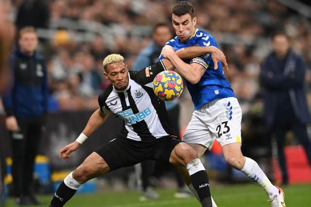 Newcastle player Joelinton is challenged by Seamus Coleman of Everton during the Premier League match between Newcastle United  and  Everton at St. James Park on February 08, 2022 in Newcastle upon Tyne, England. (Photo by Stu Forster/Getty Images)