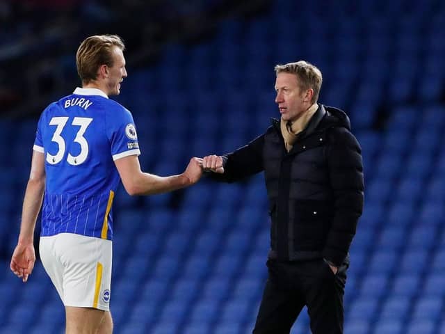 Graham Potter, Manager of Brighton and Hove Albion interacts with Dan Burn. (Photo by Andrew Couldridge - Pool/Getty Images)