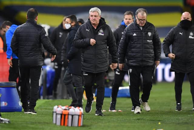 LEEDS, ENGLAND - DECEMBER 16: Steve Bruce, Manager of Newcastle United and Marcelo Bielsa, Manager of Leeds United walk off the pitch following the Premier League match between Leeds United and Newcastle United at Elland Road on December 16, 2020 in Leeds, England.The match will be played without fans, behind closed doors as a Covid-19 precaution.  (Photo by Newcastle United/Getty Images)