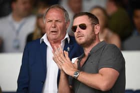 Peterborough director of football Barry Fry speaks to Peterborough chairman Darragh MacAnthony.