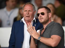 Peterborough director of football Barry Fry speaks to Peterborough chairman Darragh MacAnthony.