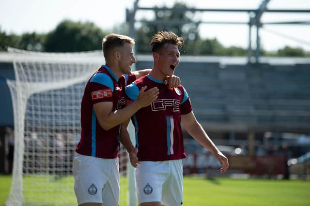 Dillon Morse, right, celebrates his goal with Jack Bodenham. Picture by Craig McNair.