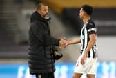 Nuno Espirito Santo congratulates Jacob Murphy.