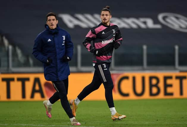 TURIN, ITALY - FEBRUARY 09: Alessandro Di Pardo of Juventus (L) and Radu Dragusin of Juventus (R) during the Coppa Italia semi-final match between Juventus and FC Internazionale at Allianz Stadium on February 9, 2021 in Turin, Italy. Sporting stadiums around Italy remain under strict restrictions due to the Coronavirus Pandemic as Government social distancing laws prohibit fans inside venues resulting in games being played behind closed doors. (Photo by Chris Ricco/Getty Images)