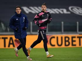 TURIN, ITALY - FEBRUARY 09: Alessandro Di Pardo of Juventus (L) and Radu Dragusin of Juventus (R) during the Coppa Italia semi-final match between Juventus and FC Internazionale at Allianz Stadium on February 9, 2021 in Turin, Italy. Sporting stadiums around Italy remain under strict restrictions due to the Coronavirus Pandemic as Government social distancing laws prohibit fans inside venues resulting in games being played behind closed doors. (Photo by Chris Ricco/Getty Images)