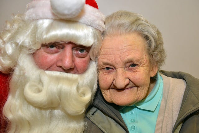 Elizabeth Skillings  from West Boldon gets a hug from Santa at the Boldon Comprehensive School OAP Christmas Party in 2017.