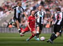 Liverpool striker Diogo Jota is fouled by Newcastle player Joelinton during the Premier League match between Newcastle United and Liverpool at St. James Park on April 30, 2022 in Newcastle upon Tyne, England. (Photo by Stu Forster/Getty Images)