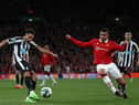 Newcastle United's English midfielder Jacob Murphy (L) shoots past Manchester United's Brazilian midfielder Casemiro (R) during the English League Cup final football match between Manchester United and Newcastle United at Wembley Stadium, north-west London on February 26, 2023. (Photo by ADRIAN DENNIS / AFP) / RESTRICTED TO