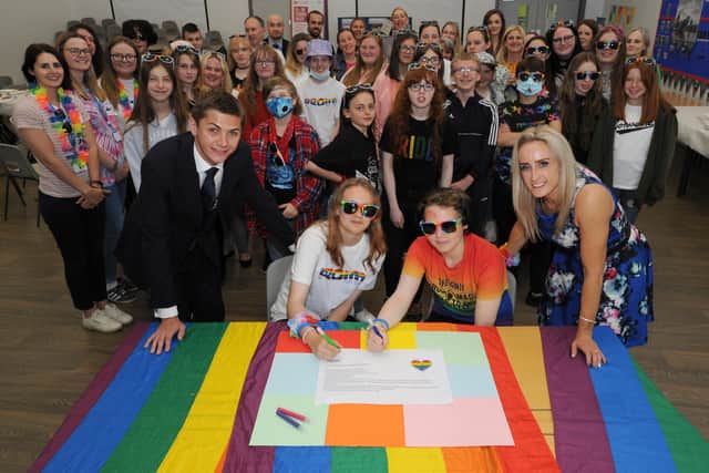 South Tyneside Council Cllr Adam Ellison joins pupils from across the Borough at Boldon School to celebrate diversity during Pride Month.  Signing the pledge are pupils Daisy Briggs and Alesha Charlton, with Cllr Ellison and Melanie Brown.