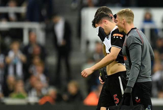 Fabian Schar was withdrawn from the clash with Arsenal at the end of last season and was replaced by a 'concussion substitute' (Photo by OLI SCARFF/AFP via Getty Images)