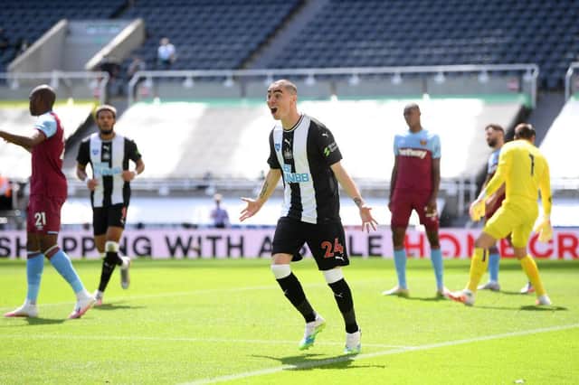 Miguel Almiron of Newcastle United celebrates after scoring his team's first goal.