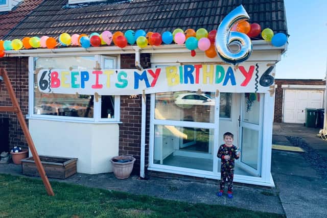 Grayson outside his home on his sixth birthday.