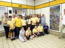 Pupils and staff from Lord Blyton Primary, with artist Laura Brenchley, right, at the newly-installed artwork on Chichester Metro station