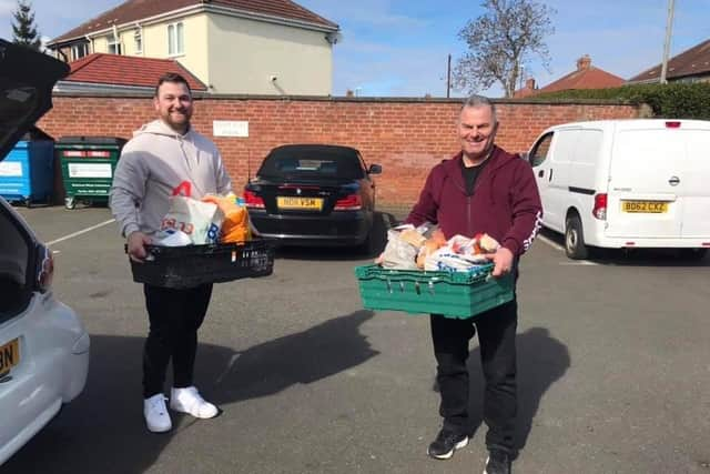 Jet 2 pilot Michael Booth (right) and son Ian volunteer with Hebburn Helps.