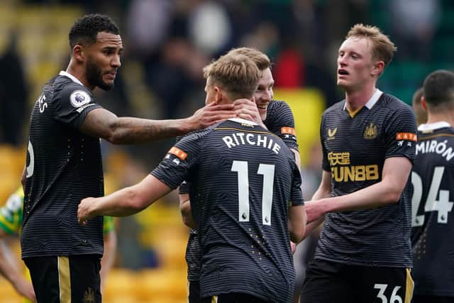 Newcastle United's Jamaal Lascelles, Matt Ritchie, Emil Krafth and Sean Longstaff celebrate the club's win at Carrow Road.