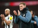 Newcastle United head coach Eddie Howe applauds fans at Wembley.