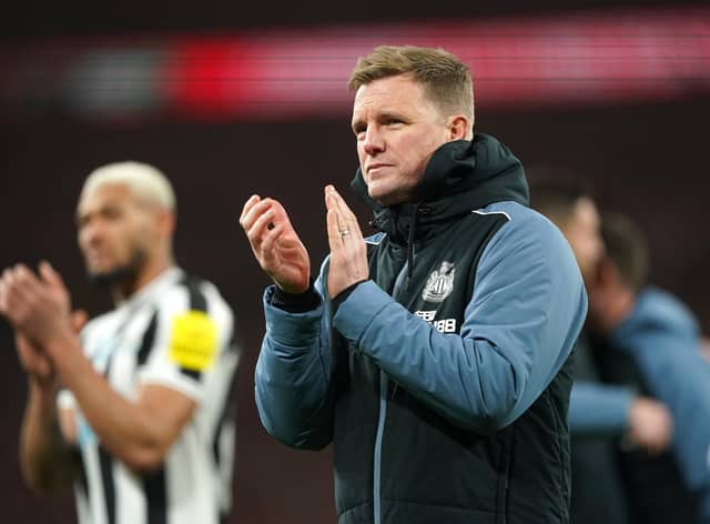 Newcastle United head coach Eddie Howe applauds fans at Wembley.