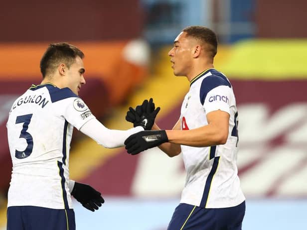 Carlos Vinicius of Tottenham Hotspur celebrates with Sergio Reguilon after scoring their side's first goal during the Premier League match between Aston Villa and Tottenham Hotspur at Villa Park on March 21, 2021 in Birmingham, England.