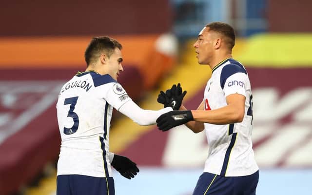 Carlos Vinicius of Tottenham Hotspur celebrates with Sergio Reguilon after scoring their side's first goal during the Premier League match between Aston Villa and Tottenham Hotspur at Villa Park on March 21, 2021 in Birmingham, England.
