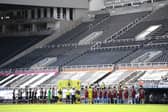 General view inside the empty stadium as the Newcastle United and West Ham United players line-up.
