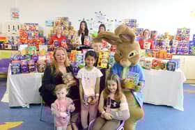 Viv Watts of Hope 4 Kidz and Peter Rabbit hand over Easter eggs to youngsters at Sunderland Royal Hospital.