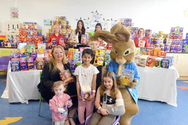 Viv Watts of Hope 4 Kidz and Peter Rabbit hand over Easter eggs to youngsters at Sunderland Royal Hospital.